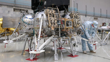An employee of the S.A. Lavochkin Research and Production Association, a Russian aerospace company, is pictured at the Luna-25 lunar lander