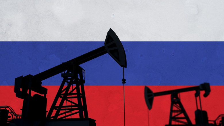Oil and gas industry background. Oil pump silhouette against a russian flag. 3D Rendering