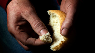 Poverty, hunger and misery last bread in hand starvation concept