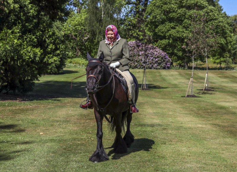 File photo dated 31/5/2020 of Queen Elizabeth II riding Balmoral Fern, a 14-year-old Fell Pony, in Windsor Home Park, close to Windsor Castle where she was in residence during the coronavirus pandemic. More than any other interest, horses and ponies have