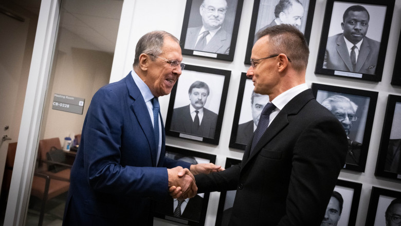 Russian Foreign Minister Sergey Lavrov and Hungarian Foreign Minister Peter Szijjarto shake hands