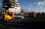 Sailors assigned to the first-in-class aircraft carrier USS Gerald R. Ford's (CVN 78) weapons department transport ammunition on the flight deck during an ammunition onload, Sept. 25, 2022. Ford is underway in Atlantic Ocean conducting carrier qualificati