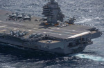 USS Gerald R. Ford (CVN 78) transits the Atlantic Ocean, March 23, 2022. Ford is underway in the Atlantic Ocean conducting flight deck certification and air wing carrier qualifications as part of the ships tailored basic phase prior operational deployment