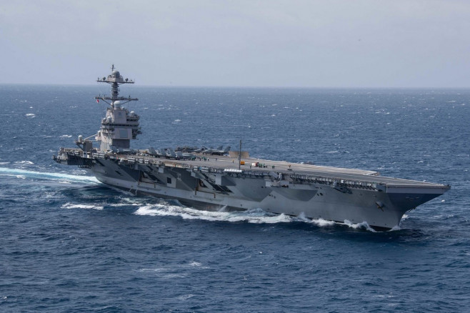 USS Gerald R. Ford (CVN 78) transits the Atlantic Ocean, March 23, 2022. Ford is underway in the Atlantic Ocean conducting flight deck certification and air wing carrier qualifications as part of the ships tailored basic phase prior operational deployment