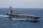 USS Gerald R. Ford (CVN 78) transits the Atlantic Ocean, March 23, 2022. Ford is underway in the Atlantic Ocean conducting flight deck certification and air wing carrier qualifications as part of the ships tailored basic phase prior operational deployment