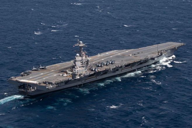 USS Gerald R. Ford (CVN 78) transits the Atlantic Ocean, March 23, 2022. Ford is underway in the Atlantic Ocean conducting flight deck certification and air wing carrier qualifications as part of the ships tailored basic phase prior operational deployment