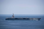 USS Gerald R. Ford (CVN 78) transits the Atlantic Ocean, March 30, 2022. Ford is underway in the Atlantic Ocean conducting flight deck certification and air wing carrier qualification as part of the ships tailored basic phase prior to operational deployme