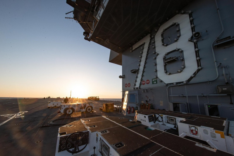 Sailors assigned to USS Gerald R. Ford (CVN 78) prepare for flight operations on the flight deck, April 9, 2022. Ford is underway in the Atlantic Ocean conducting carrier qualifications and strike group integration as part of the ships tailored basic phas
