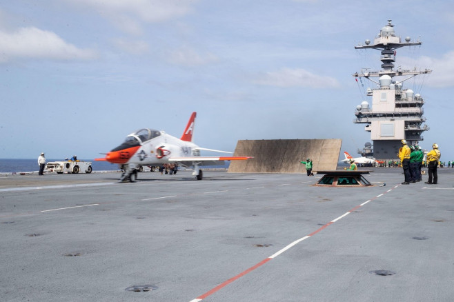 A T-45C Goshawk, attached to Training Air Wing 1, launches from USS Gerald R. Ford's (CVN 78) flight deck, June 17, 2022. Ford is underway in the Atlantic Ocean conducting Chief of Naval Air Training Command (CNATRA) carrier qualifications. (U.S. Navy pho