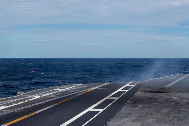 A rolling airframe missile (RAM) launcher fires a RIM-116 missile from the first-in-class aircraft carrier USS Gerald R. Ford (CVN 78) during a combat systems training exercise, Sept. 24, 2022. Ford is underway in the Atlantic Ocean conducting carrier qua