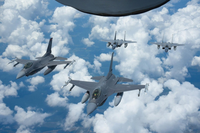 U.S. Air Force F-16's from the Oklahoma Air National Guard's 138th Fighter Wing Detachment 1, and U.S. Air Force F-15's from the Louisiana Air National Guard's 159th Fighter Wing form up behind a KC-135 Stratotanker from the Alabama Air National Guard's 1