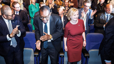 KWASI KWARTENG and LIZ TRUSS are seen stood alongside each other at the opening of the conference . Th