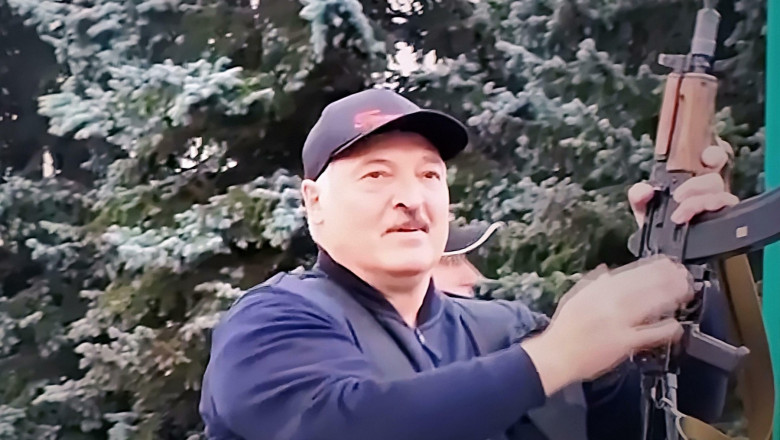 President of Belarus Alexander Lukashenko with a gun
