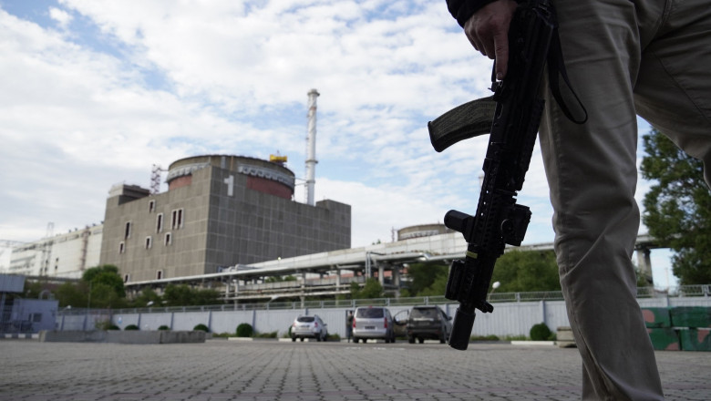 security person standing in front of the Zaporizhzhia Nuclear Power Plant in Enerhodar (Energodar), Zaporizhzhia Oblast