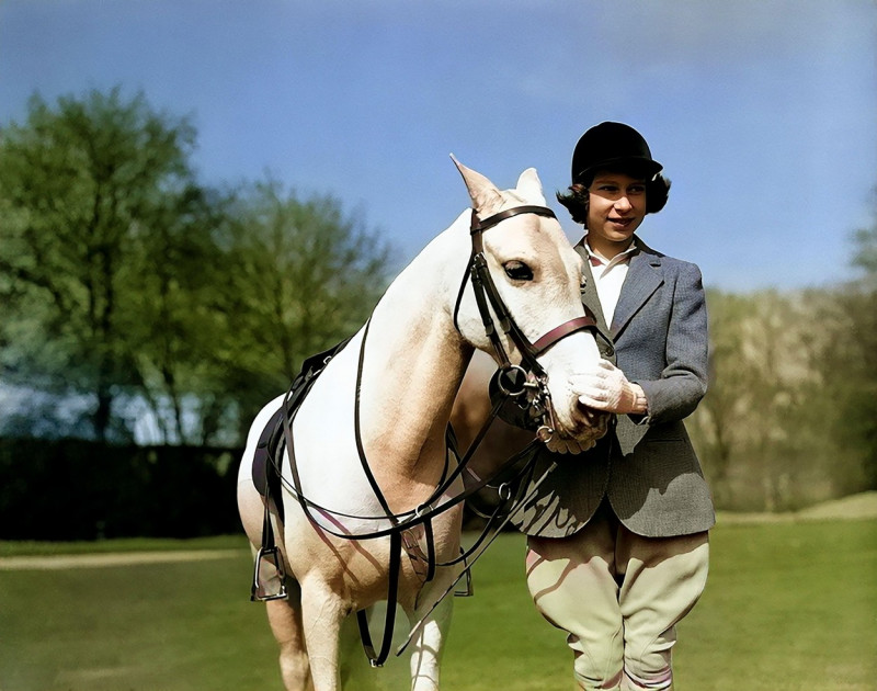 Young Elizabeth II with a horse