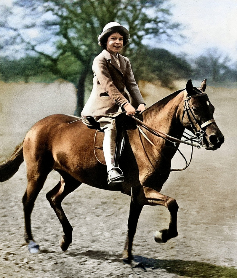 Elizabeth II as a baby riding a horse