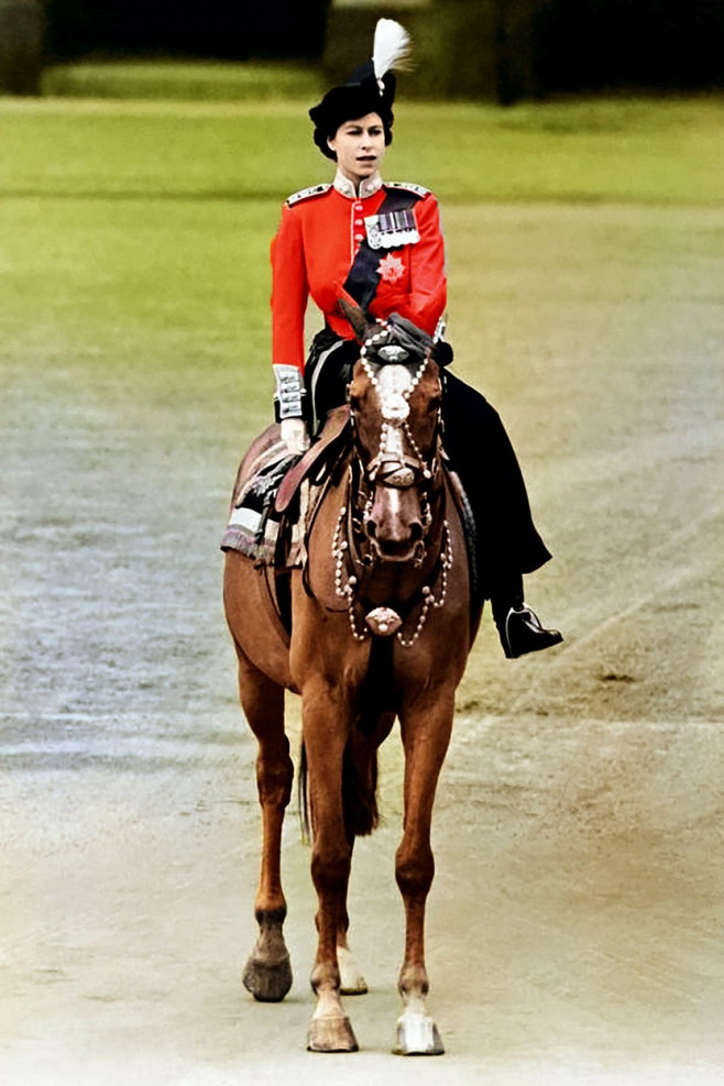 Queen Elizabeth II rides on 1952 a horse during a Trooping of the Colour ceremony at Horse Guard's Parade