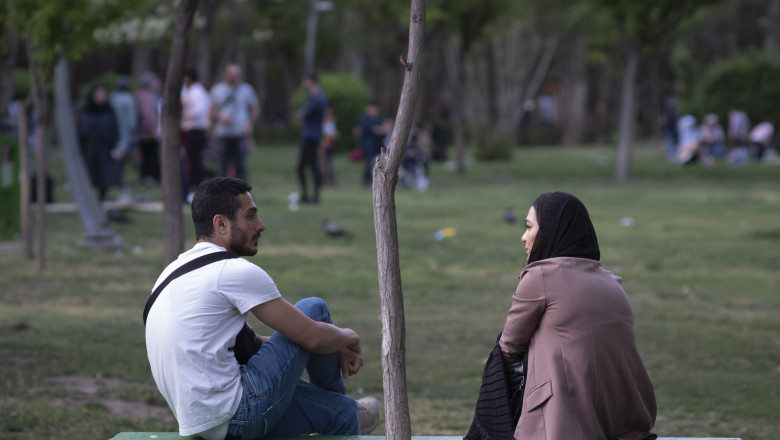 Iran, Tehran, Men And Women In A Park - 11 Apr 2022