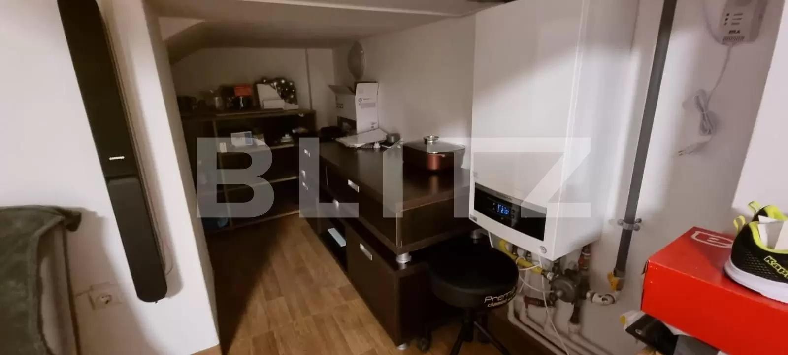 Un „apartament” în spațiul parcării și boxelor la nivelul minus 2 al unui bloc din Cluj a fost pus la vânzare. Are și centrală pe gaz
