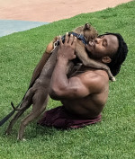 EXCLUSIVE: Strong Man Zion Clark An Inspirational Wrestler Plays With His Puppy At The Beach