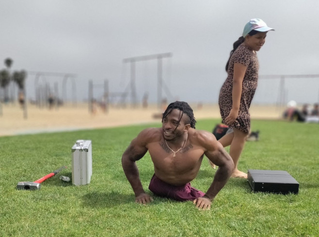 EXCLUSIVE: Strong Man Zion Clark An Inspirational Wrestler Plays With His Puppy At The Beach