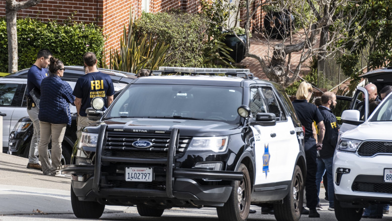 Local and Federal law enforcement confer outside the house where an assilant attacked Paul Pelosi, the husband of Speaker of ther House Nancy Pelosi, at the couple's home In San Francisco
