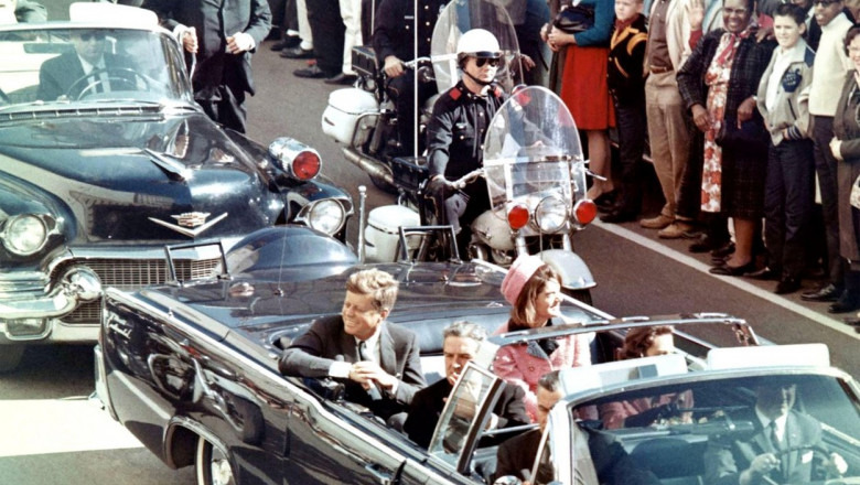 JOHN F. KENNEDY (1917-1963) with his wife Jacqueline moments before he was killed in Dallas on 22 November 1963. Photo: Walt Cisco