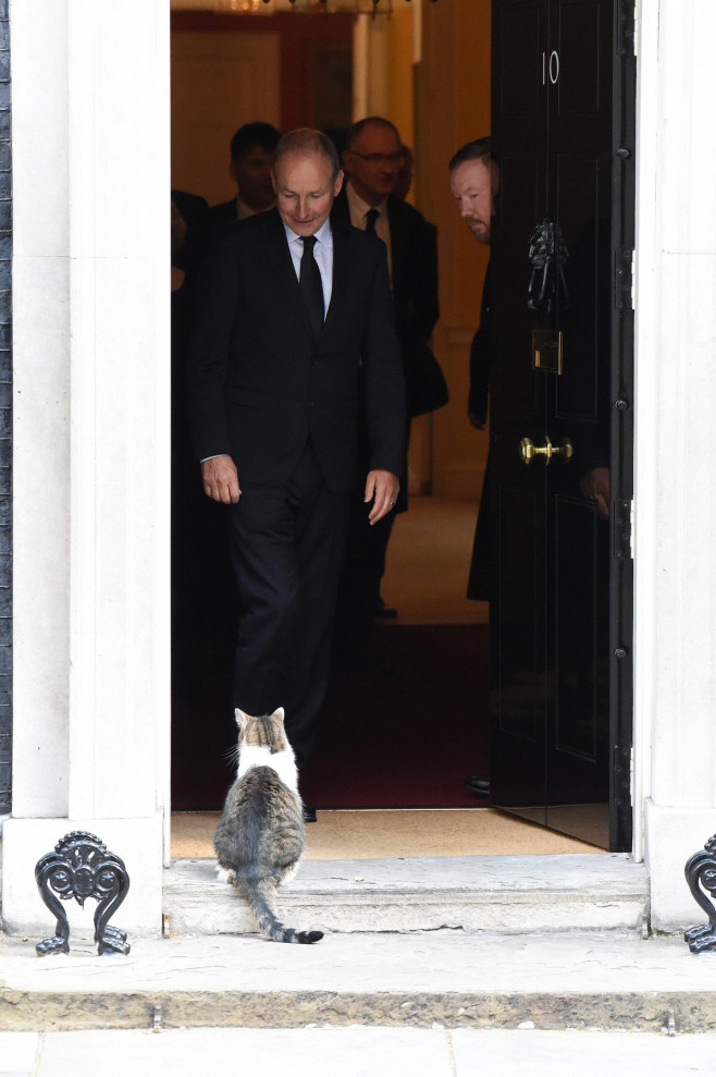 London, UK. 18th Sep, 2022. Michael Martin Irish Taoiseach leaves No10 Downing Street this morning after a meeting with Liz Truss British Prime Minister and is greeted by Larry the Cat Credit: MARTIN DALTON/Alamy Live News