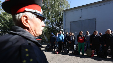 Men conscripted for military service during partial mobilization are seen outside a military commissariat in Krasnodar, Russia