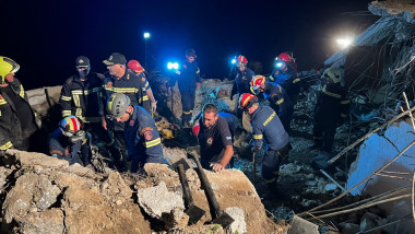 Firemen search in debris after a landslide in Agia Fotia, near Koutsounari, southeastern Crete