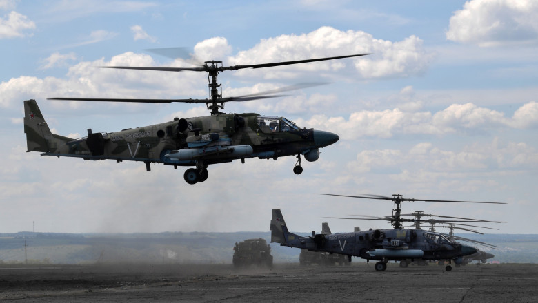 Russian Kamov Ka-52 "Alligator" reconnaissance and attack helicopters are seen at an airfield before a combat mission in the course of Russia's military operation in Ukraine
