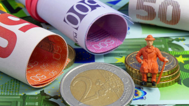 Pension as a symbolic image with euro banknotes and coins