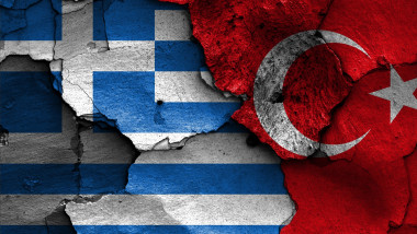 flags of Greece and Turkey painted on cracked wall