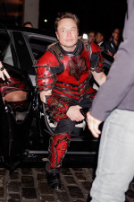 Elon Musk wears a knight costume with an upside-down cross on the back as he arrives at Heidi Klum’s Halloween party in NYC