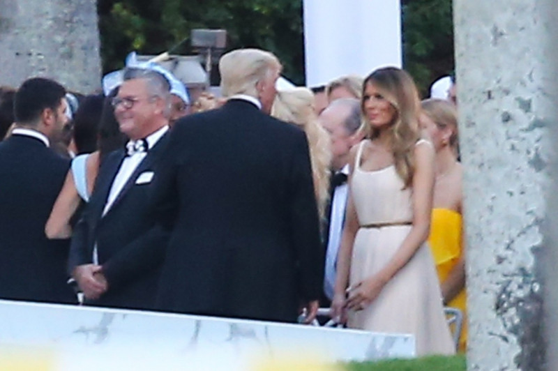 Donald and Melania Trump chat during Tiffany Trump's wedding in Palm Beach