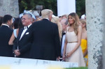 Donald and Melania Trump chat during Tiffany Trump's wedding in Palm Beach