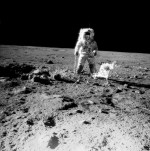 (19-20 Nov. 1969) --- One of the Apollo 12 crew members is photographed with the tools and carrier of the Apollo Lunar Hand Tools (ALHT) during extravehicular activity (EVA) on the surface of the moon. Several footprints made by the two crew members durin