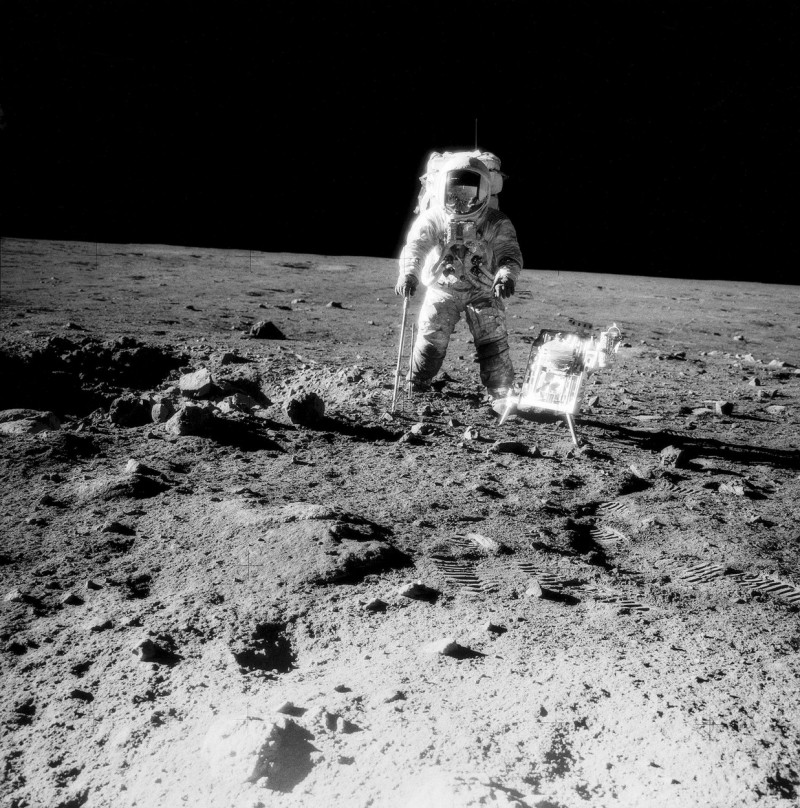 (19-20 Nov. 1969) --- One of the Apollo 12 crew members is photographed with the tools and carrier of the Apollo Lunar Hand Tools (ALHT) during extravehicular activity (EVA) on the surface of the moon. Several footprints made by the two crew members durin