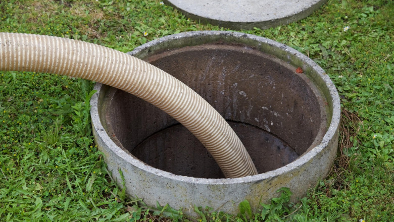 Septic tank: the removal of sewage sludge and cleaning of a domestic septic tank in the garden of rural French property.