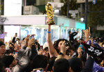 Japanese football fans celebrate Japan's victory at the FIFA World Cup