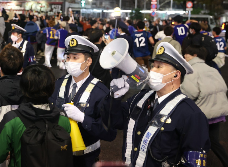 Japanese football fans celebrate Japan's victory at the FIFA World Cup