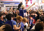 Japanese football fans celebrate Japan's victory at the FIFA World Cup