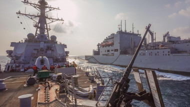 Guided-missile destroyer USS The Sullivans (DDG 68) conducts a replenishment-at-sea with dry cargo and ammunition ship USNS Matthew Perry (T-AKE 9) in the Gulf of Aden, Nov. 6