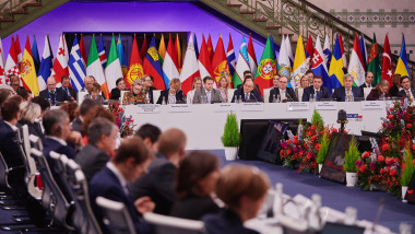 OSCE Chairperson-in-Office and Polish Foreign Minister Zbigniew Rau (6R) presides the closing plenary session of the 29th Ministerial Council meeting of the OSCE