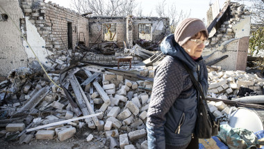 Ukrainian elderly woman, 70-year-old, Valentina Untura inspects a destroyed building in Posad-Pokrovske village, Kherson, Ukraine