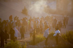 TX: Migrants wait on North embankment of the Rio Grande