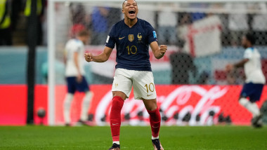 Kylian Mbappe of France celebrates as Harry Kane of England misses a penalty in the second half
