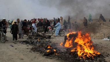 Residents gather after Taliban forces fired mortars at Pakistan's border town of Chaman on December 11, 2022.