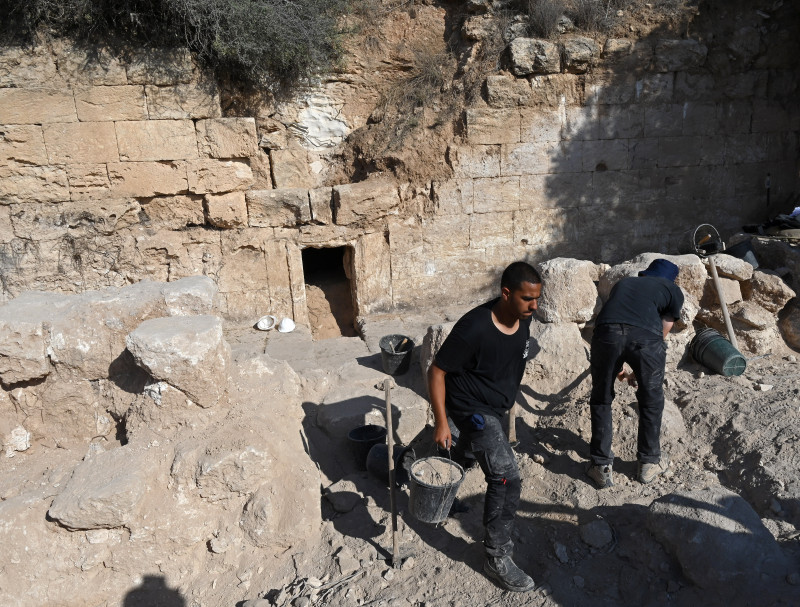 A Worker Excavates Outside The Entrance To The Salome Cave In The Lachish Forest