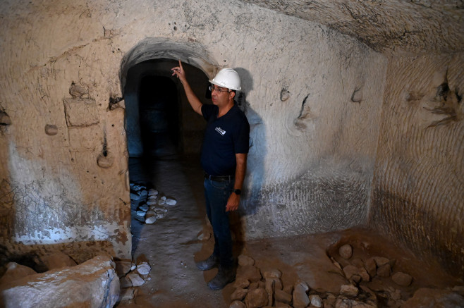 Archeologist Saar Ganor Points To The Greek Dedication Inscription To Salome Inside The Salome Burial Cave